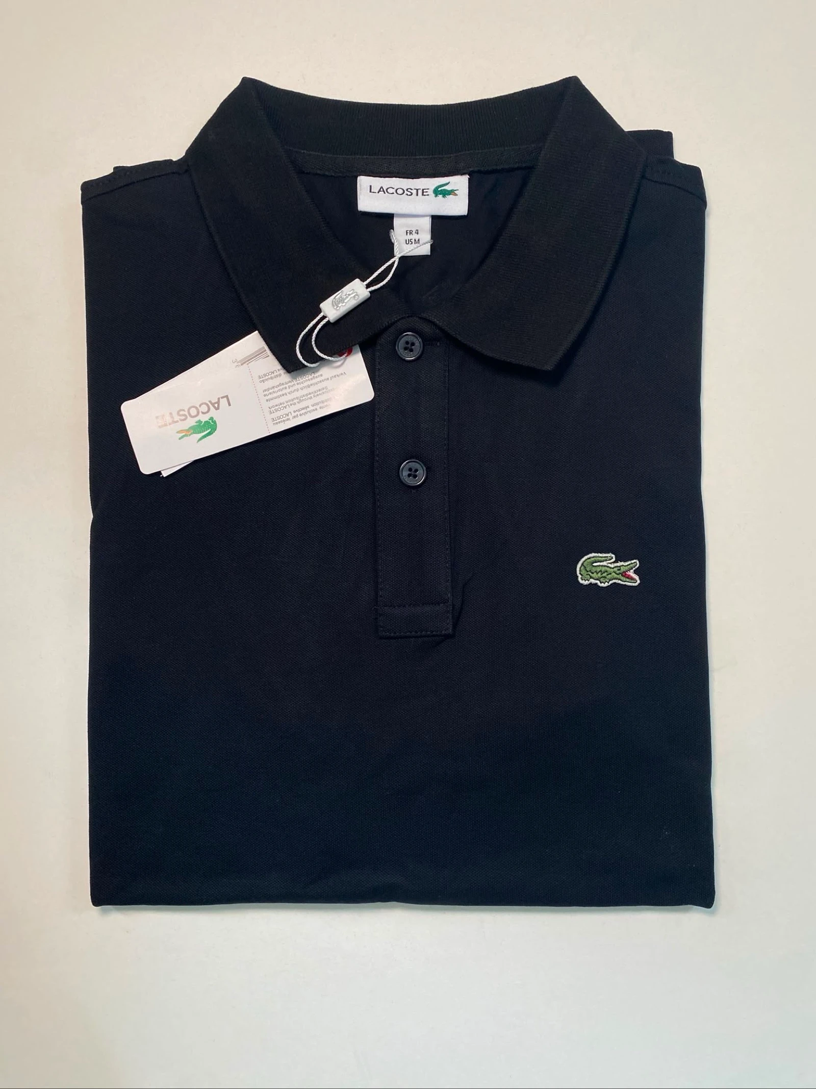 Polo Lacoste noir neuf avec étiquette 